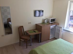 Η κουζίνα ή μικρή κουζίνα στο Jūratės gatvės svečių namai +16 φωτογραφίες