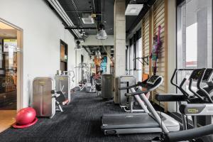 a gym with several treadmills and cardio machines at Comfort Hotel LT - Rock 'n' Roll Vilnius in Vilnius