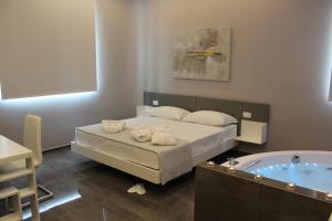 Postel nebo postele na pokoji v ubytování Kalì B&B