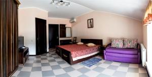 Posteľ alebo postele v izbe v ubytovaní Dergachov Guest House