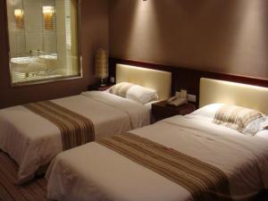 Cama o camas de una habitación en Beijing Tibet Hotel