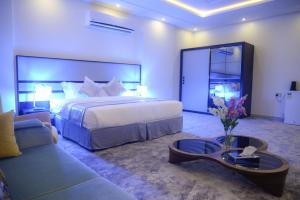 A bed or beds in a room at Gardenia Furnished Units