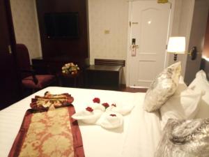 Postel nebo postele na pokoji v ubytování Sherar Addis Hotel