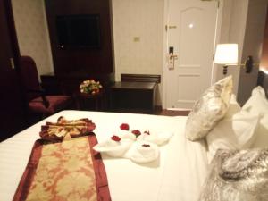 Postel nebo postele na pokoji v ubytování Sherar Addis Hotel