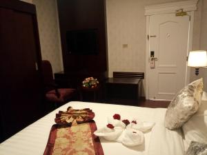 Postel nebo postele na pokoji v ubytování Sherar Addis Hotel