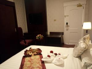 Postel nebo postele na pokoji v ubytování Sherar Addis Hotel