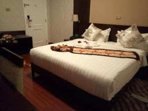 Postel nebo postele na pokoji v ubytování Sherar Addis Hotel
