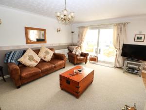 a living room with a couch and a coffee table at The Twickle in North Walsham