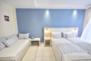 Postel nebo postele na pokoji v ubytování Blue Senses Hotel