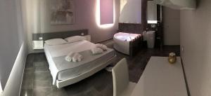Postel nebo postele na pokoji v ubytování Kalì B&B