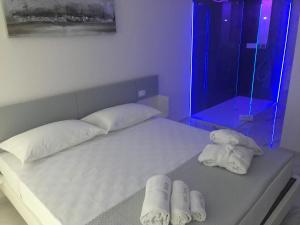 Postel nebo postele na pokoji v ubytování Kalì B&B