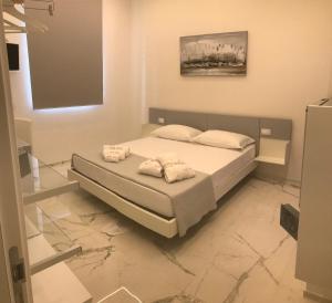Postel nebo postele na pokoji v ubytování Kalì B&B