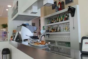 A kitchen or kitchenette at Hotel Manuela