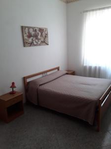 Posteľ alebo postele v izbe v ubytovaní B&B La Scapola