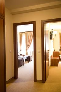 A bed or beds in a room at Favorit Hotel