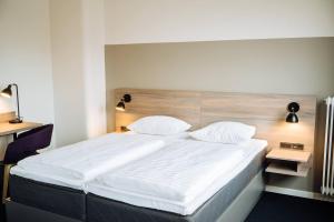 Letto o letti in una camera di Copenhagen Go Hotel