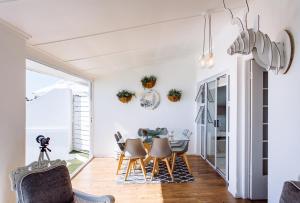 a dining room with a table and chairs at 16 Mile View in Yzerfontein