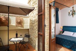 Postel nebo postele na pokoji v ubytování Hotel Ristorante Piccolo Chianti