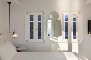 Letto o letti in una camera di Erosantorini Estate