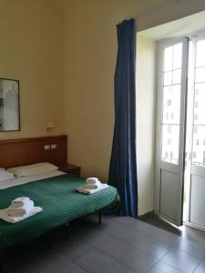 Postel nebo postele na pokoji v ubytování Palma Residences In Rome