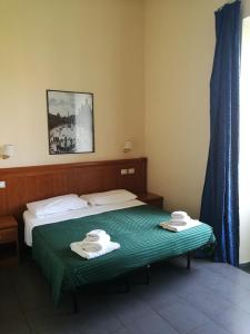 Postel nebo postele na pokoji v ubytování Palma Residences In Rome
