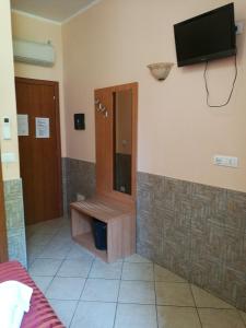 TV a/nebo společenská místnost v ubytování Palma Residences In Rome