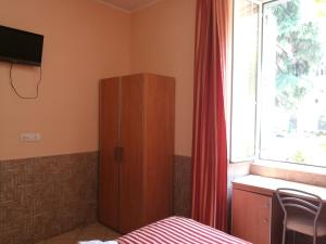 TV a/nebo společenská místnost v ubytování Palma Residences In Rome
