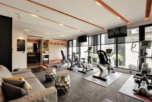 a gym with treadmills and cardio equipment in a building at Starhaus Hotel in Kaohsiung