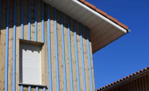 a building with awning and a window on it at Residence Plage Oceane in Biscarrosse-Plage