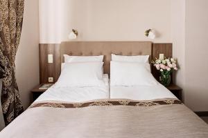 Postel nebo postele na pokoji v ubytování Time Hotel