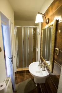 a bathroom with a sink and a shower at Star Apartments in Piešťany +38 photos