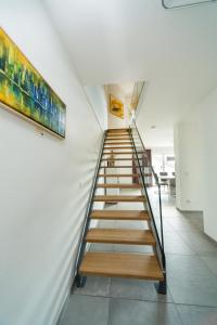 a stairwell in a building with a stair case at Hotel Restaurant Sailer in Seewalchen