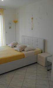 Postel nebo postele na pokoji v ubytování Apartment Rosana