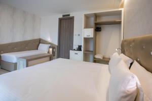 Postel nebo postele na pokoji v ubytování Park Hotel Marinetta - Beach & Spa