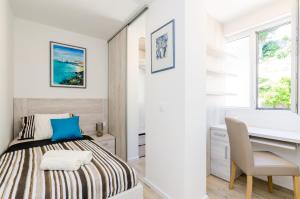 Ein Bett oder Betten in einem Zimmer der Unterkunft Apartments Lazarin