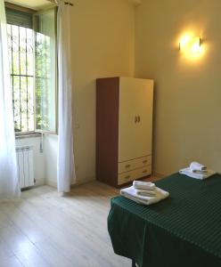 Postel nebo postele na pokoji v ubytování Palma Residences In Rome