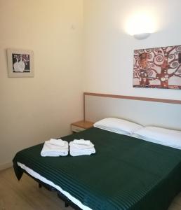 Postel nebo postele na pokoji v ubytování Palma Residences In Rome