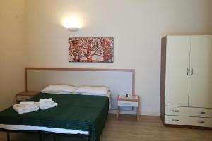 Postel nebo postele na pokoji v ubytování Palma Residences In Rome