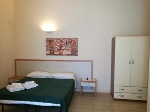 Postel nebo postele na pokoji v ubytování Palma Residences In Rome