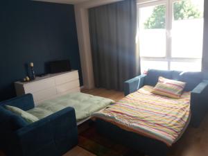 Łóżko lub łóżka w pokoju w obiekcie Apartament Pruszków