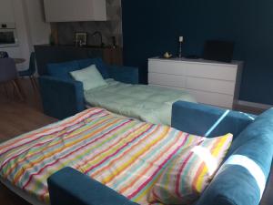 Łóżko lub łóżka w pokoju w obiekcie Apartament Pruszków