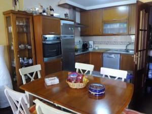 A kitchen or kitchenette at Ático al lado del mar,en las rías baixas