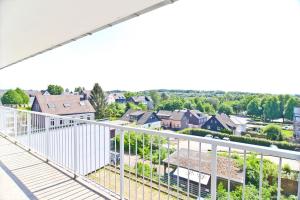 a balcony with a view of a suburb at Top Apartmentwohnungen Heiligenhaus in Heiligenhaus