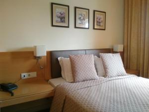 Cama o camas de una habitación en Hotel Mira D'Aire