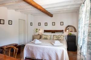 Postel nebo postele na pokoji v ubytování Eremo della Maddalena