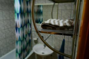 a towel sitting on a shelf in a bathroom at Villa AMANI in Sarajevo +21 photos