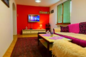 a living room with a couch and a table at Villa AMANI in Sarajevo