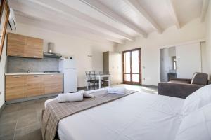 Giường trong phòng chung tại Villa Maria Salento