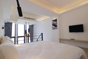 Postelja oz. postelje v sobi nastanitve KET Hotel