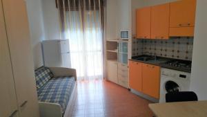 A kitchen or kitchenette at Condominio Simma 2